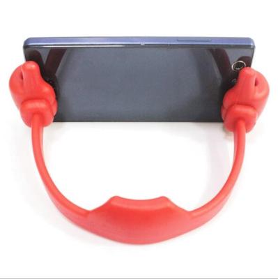 China Hot Sale PP Promotional Flexible Portable Thumb OK Mobile Phone Holder for sale