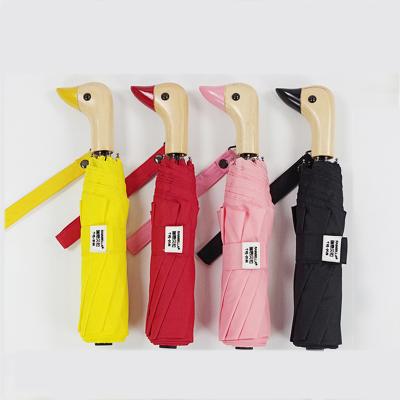 China All In 1 Handle 3 Folds Wholesale Manually Open Yellow Wooden Duck Umbrella for sale