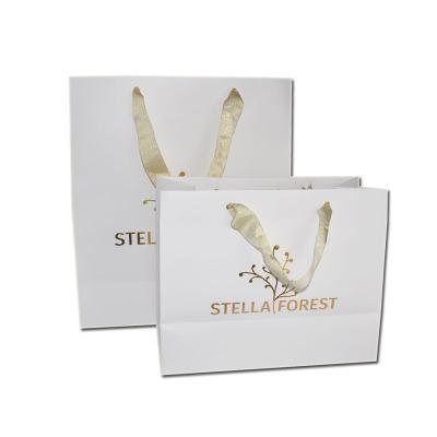 China Recycled Materials Printing Cardboard Custom Shopping Shoes Clothing Promotion Brand Paper Bags With Logo for sale