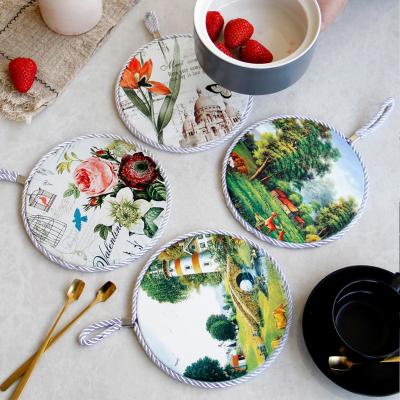 China Hot Customized Ceramic Coaster Kitchen Ceramic Tripod Pot Place Mat Minimalist Dining Table Coaster With Rope for sale