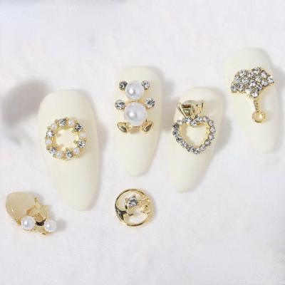 China Luxury Hollow Opal Metal Kawaii Manicure Nails DIY Decorations 3D Bow Zircon Garland Art Nail Charms Large Metal Heart Pearl for Girls for sale