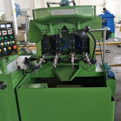 China Hotels M8- M10 High Precision Automatic Hex Nut Tapping Machine Four Axis Tapping Machine for sale