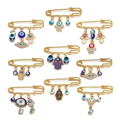 China ALLOY Best-selling Palm Turkey Blue Eye Safety Charm Gold Diamond Crystal Collar Pin Evil Eyes Simple Necklace Pin Brooch For Kids for sale