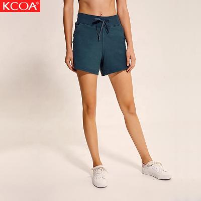 China Antibacterial Custom Logo Printing Quick Fry Loose Women's Yoga Shorts With Pockets for sale