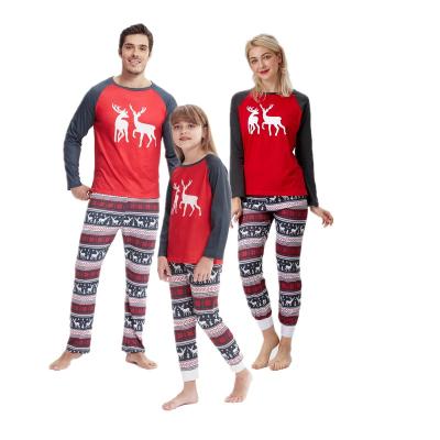 China 2023 QUICK DRY wholesale christmas pajamas family matching new year print long sleeve pants for women and men for sale