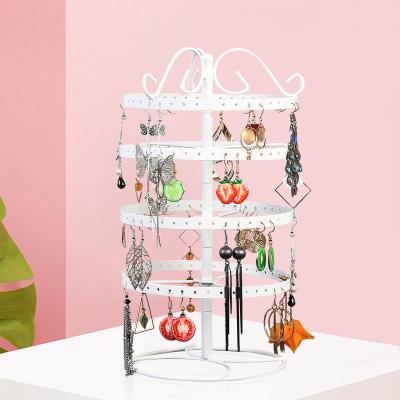 China Creative Four-layer Jewelry Storage Rack Earring Metal Jewelry Rack Home Necklace Rotating Rack for sale