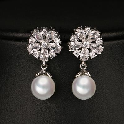 China FASHIONABLE Brides Wedding Imitation Pearl Snowflake Zircon Silver Stud Earrings For Women Fashion Jewelry Earring for sale