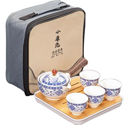 China 360 Degree Sustainable Rotating Ceramic Teapot Lazy Teapot Tea Making Tea Set Portable Travel Tea Set Household Blue And White for sale