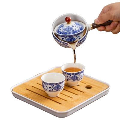 China 360 Degree Sustainable Rotating Ceramic Teapot Lazy Teapot Tea Making Tea Set Portable Travel Tea Set Household Blue And White for sale