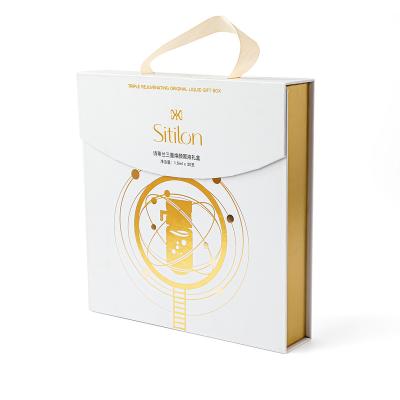 China Custom Logo Premiumskincare Gift Box Rigid Materials Recycled Cardboard Magnetic Gift Boxes With Ribbon for sale