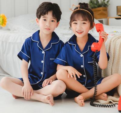 China Leisure 2021 children's color short pure silk pajamas home wear boys and girls solid silk child summer sleepwear set for sale