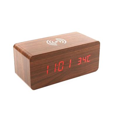 China MDF Time-Temperature Wooden Alarm Clock Mobile Phone Display Phone Wireless Charger for sale