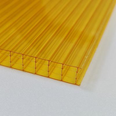 China Fabrieksprijs Geel 10mm Vierlaagse Polycarbonaat Holle Plaat De ultieme combinatie van Isolatie Impact Resistance en UV-bescherming Te koop