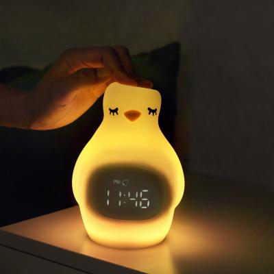 China Cartoon Electric Outlet Factory Selling Custom LED Baby Logo Penguin Silicone Alarm Clock Night Light for sale