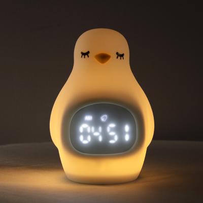 China Cartoon Multifunctional Morning Wake Up Mengdo Penguin Alarm Clock LED Lamp Silicone Night Light for sale