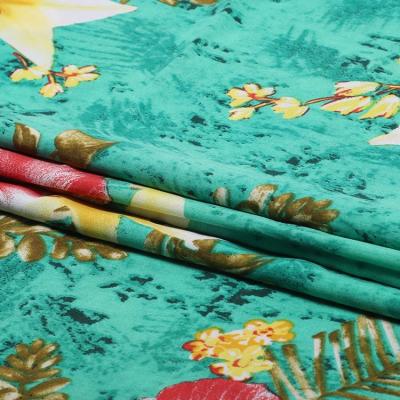 China Simple Customized Pattern Green Ground Large Woven Floral 100% Printed Viscous Fabric for sale