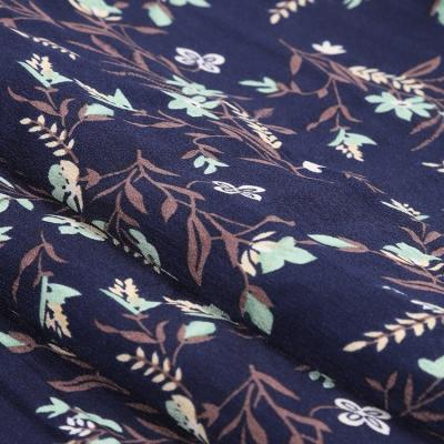 China Woven Stocked Memory Leaves Printed Pattern Polyester Elastic Crepe Fabric for sale