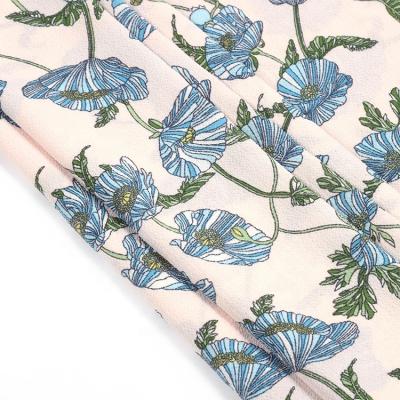 China Custom Printing Blue Memory Pattern Flower Print Polyester Woven Bubble Crepe Fabric for sale