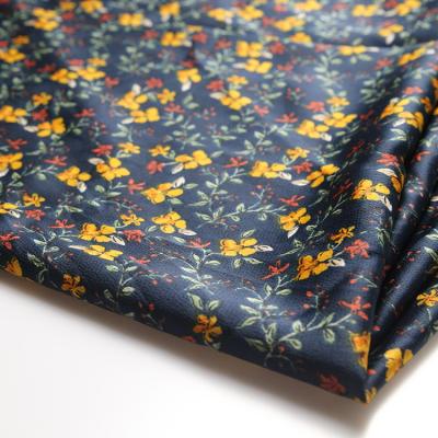 China Shrink-Resistant Tropical Island Navy Ground Yellow Floral Print Polyester Taffeta Fabric For Women for sale