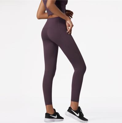 China Breathable women with pockets high-waist yoga pants for sale