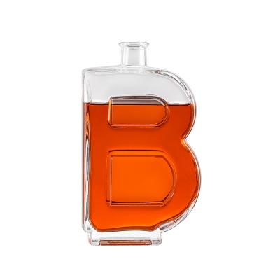 China Custom Unique Beverage Factory Shape 750ml Letter B Freeze Glass Bottle Whiskey Brandy Liquor Bottles for sale