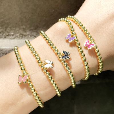 China TRENDY Fashion Personality Fashion 18k Gold Ball Bead Bracelet Enamel Butterfly Charm Ball Elastic Beads Bracelet for sale