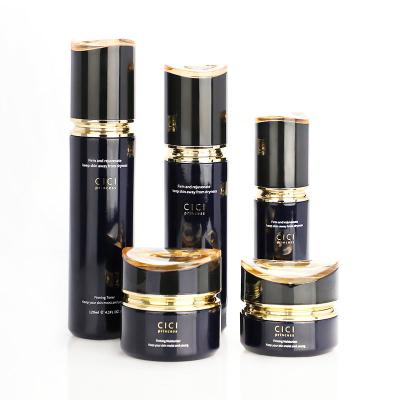 China Black Luxury Glass Gold Cream Jar Lotion Cylinder Bottle Set Supplier Cosmetic Bottle Set for sale