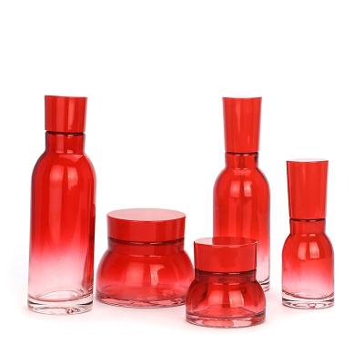 China Latest Design Manufacturer China Wholesale Cream Jar 50g Skin Care Glass Bottle Red Lotion Squeeze Bottle for sale