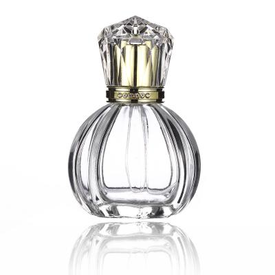 China 50ml Unique Shape Cosmetic Luxury Exquisite Perfume Bottle Round Clear Perfume Bottle Spray Glass Bottle for sale