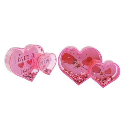 China Hot Selling Plastic DIY Heart Shape Picture Frame Clear Acrylic Liquid Snow Globe Water Globe For Valentine's Day for sale