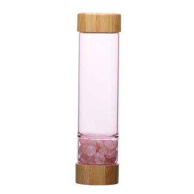 China Sustainable Pink Rose Quartz Crystal Water Bottle With Bamboo Lid for sale