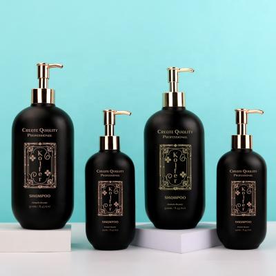 China Custom Luxurious Silk Screen Printing 250ml 500ml Cosmetic Black Shampoo Bottle With Gold Pump for sale