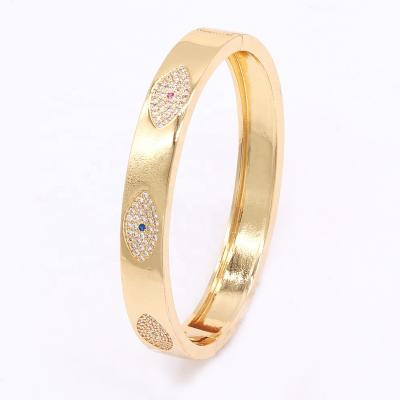 China 2021 Latest Fashion Eye Stone Gold Plated Brass Female Bangle Bracelets Trendy Jewelry for sale