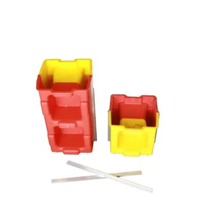 China Wholesale supply high quality plastic injection red yellow interlocking concrete hollow block mold zu verkaufen