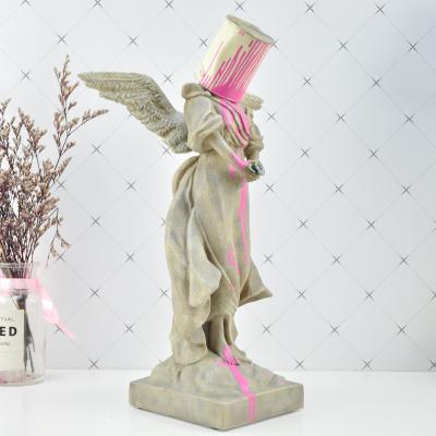 China Europe Pour Street Art Resin Angel Top Figurine Original Fake Banksy Paint Iron Bucket Sculpture for sale