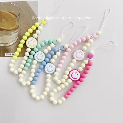 China New Korean Version Cartoon Acrylic Smiley Candy Color Beaded Lanyard Mobile Phone Chain for sale