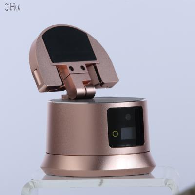 China 360 Rotation Adjustable Smart Face Tracking Tripod Selfie Auto Face Tracking Tripod Smart After Face and Object Shots for sale