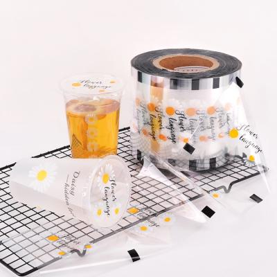 China Customized Logo PP Cup Sealing Film Boba Tea Cup Milk Tea Cup Paper Seal Moisture Proof Plastic Roll Film for sale