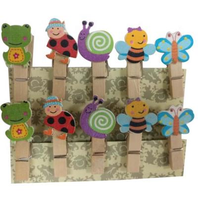 China Europe cute wooden clothespins/pegs/clips with frog, ladybug, snail, bee, butterfly designs for sale