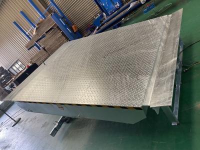 China Forklift Loading 6T Hot Dip Galvanized Electric Dock Leveler For Particular Loading Bay Area for sale