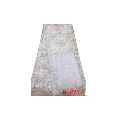 China Sustainable Quality Latest Nigeria White Tulle Lace Fabric For Wedding Dresses for sale