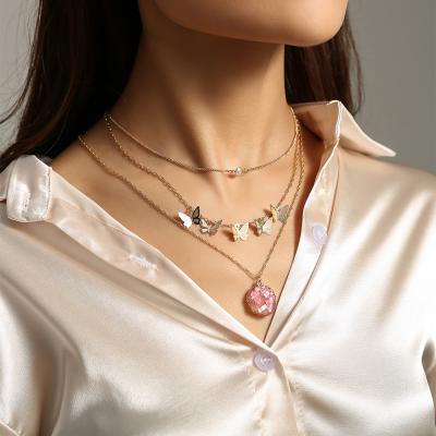 China Durable Soft Pink Imitate Natural Stone Dangling Tassel Bead Necklace Butterfly Multilayer Necklace For Women for sale