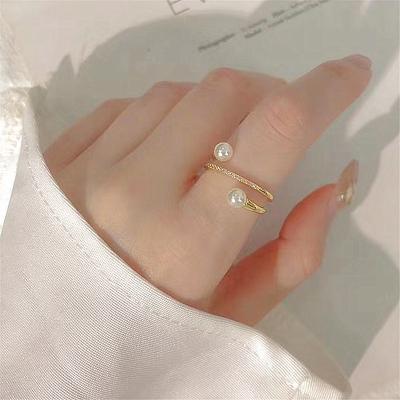 China New High Quality Micro Inlaid Zircon Pearl Geometric Layered Crossed Pearl Finger Ring Rings For Women for sale