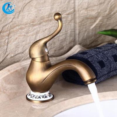 China Metered Faucets Bathroom Single Hole Handle Modern Clothes Gold Basin Wash Faucet for sale