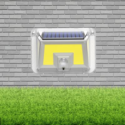 China New 100 Waterproof Outdoor Led Solar Garden Solar Panel Power Motion Sensor Garden Lights for sale