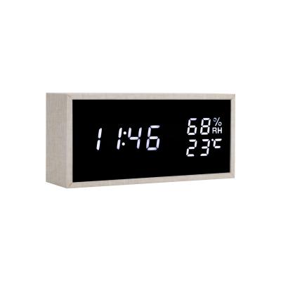 China New Design LUMINOVA Decorative Bedside Sound Control Wooden Digital Alarm Clock With 3 Levels Adjustable Brightness for sale