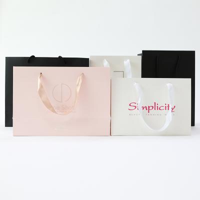 China Recycled Materials Hair Beauty Paper Bags OEM Logo Folding Shopping Bags For Cosmetics Package for sale