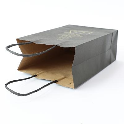 China Biodegradable Large Capacity Biodegradable Wax Kraft Heavy Duty Paper Bags With Ribbon Handles for sale