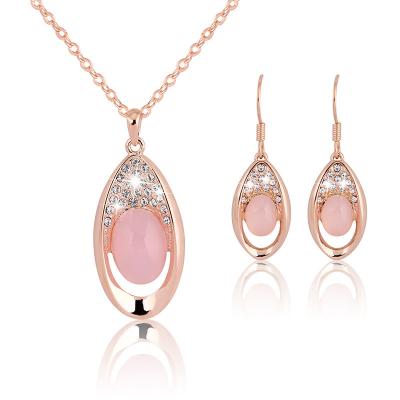 China Romantic Hot Sale Anniversary Party Oval Rhinestone Necklace Set Natural Crystal Hibiscus Pink Crystal Ladies Jewelry Set for sale