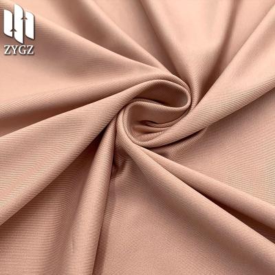 China 260GSM viable knit milk spandex tensile backing fabric t-shirt sleeve shirt swimwear silk short pajama fabric wholesale stocking volume for sale